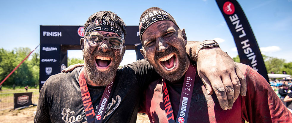 Spartan racers celebrating with their medals