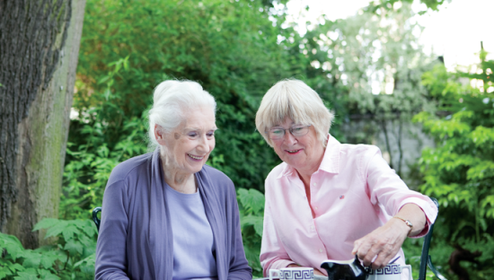 Two ladies sitting in the garden