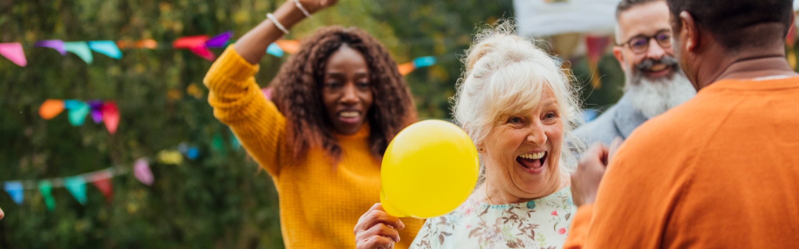 A group of friends and family celebrate a garden party