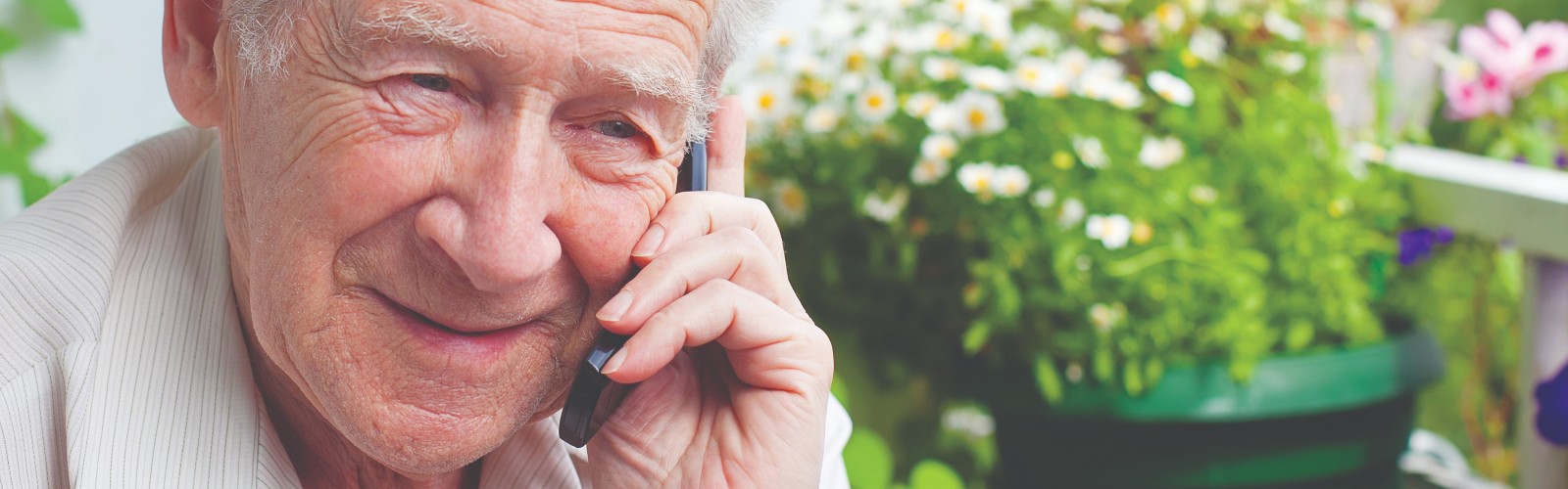 An older man speaking on the phone