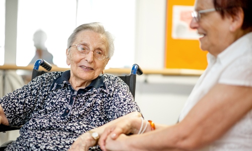 An older lady and her carer