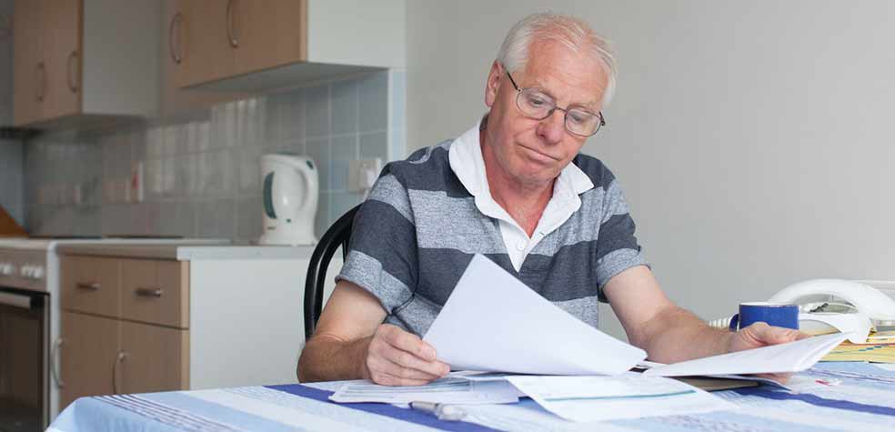 Man filling paperwork