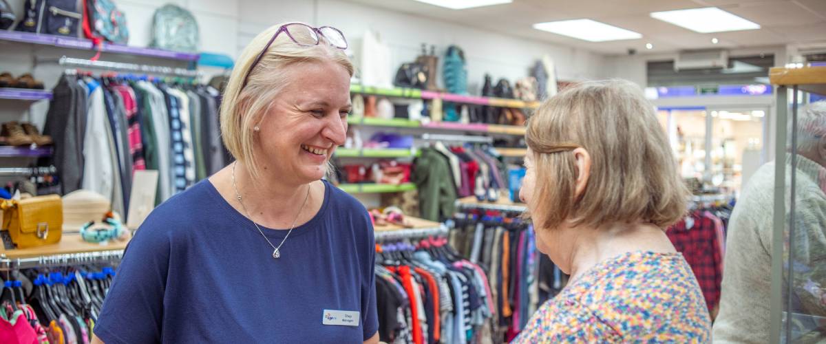 Age UK Biggleswade shop volunteers talking 1200x500.jpg